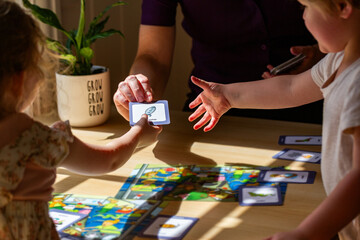 allied health professional speech therapist using cards for speech development