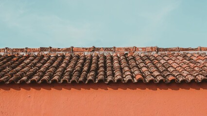Macro image of an aged orange exterior wall and roof