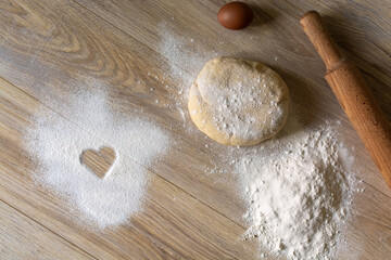 Homemade Baking Ingredients with Heart Symbol in Flour