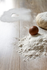 Homemade Baking Ingredients with Heart Symbol in Flour