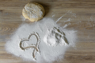 Homemade Baking Ingredients with Heart Symbol in Flour