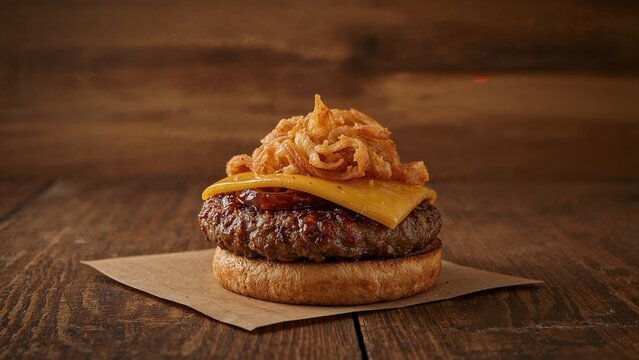 Delicious sausage sandwich topped with onions and melted cheese