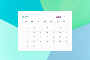 August calendar card for 2026 year on colorful background. Flat lay.