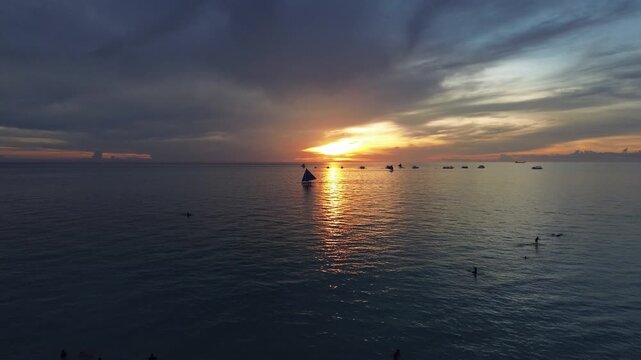 Traditional Paraw Sailboat at Sunset - Philippine Beach Drone Shot