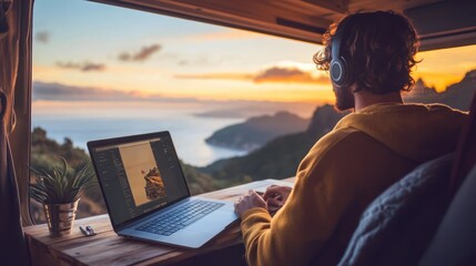 Man works on laptop by sunset view