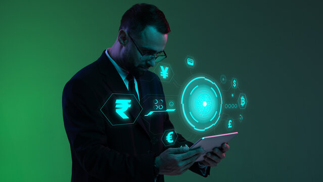 Businessman with digital currency icons and green holographic interface in neon lightning. Concept of fintech UX, banking apps, currency exchange dashboards, personal finance tools.