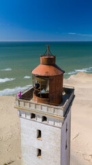 Breathtaking views from the top of a vintage lighthouse along the beautiful coast of Denmark. A...