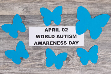 Blue shapes of butterflies and inscription April 02 World Autism Awareness Day. Symbol of Autism...