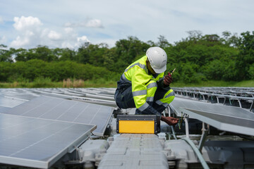 African-American engineer carefully examines cutting-edge floating solar panel system designed to...