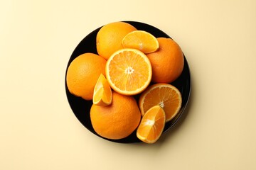 Fresh ripe oranges on beige background, top view