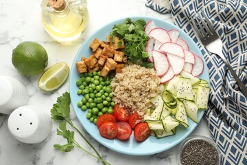 Different healthy vegetarian food served on white marble table, flat lay