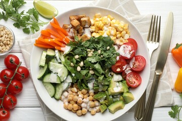 Different healthy vegetarian food served on white wooden table, flat lay
