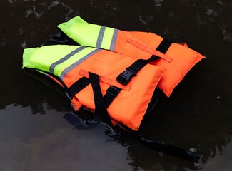 High Visibility Life Jacket Floating on Water Surface