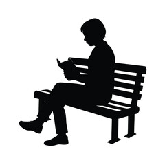 Silhouette of a person reading on a bench