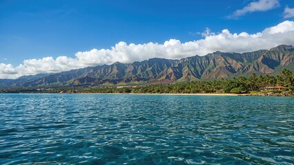 Scenic seaside landscape featuring mountains and vibrant blue waters