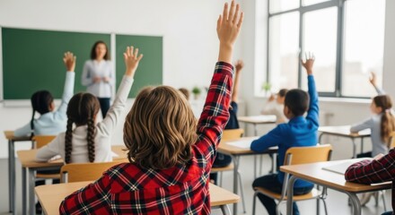 Students Raising Hands in a Classroom During a Lesson