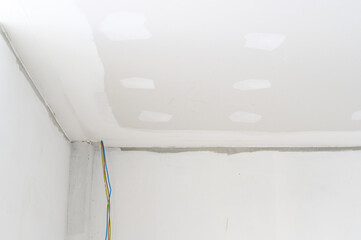 Gypsum board ceiling smooth edges interior renovation electrical wire plastering shows building...