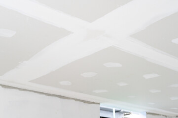 Building interior renovation gypsum board ceiling installation construction smooth plastering edges electrical wire ceilings space anticipation quality finish bare surface detail view potential