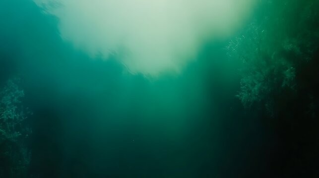 Abstract underwater world background with turquoise hues and ethereal light beams