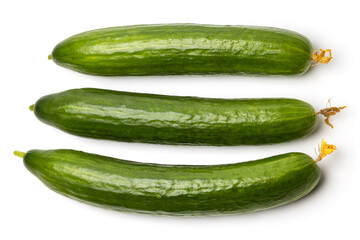 Photo of three green ripe natural organic cucumbers isolated on white background