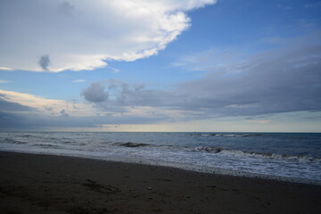 Dark Sandy Beach with Waves and Cloudy Sky in Banda Aceh