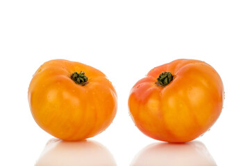 Yellow juicy tomatoes isolated on white background, close-up.