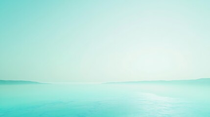 Serene teal seascape with distant mountains and calm water for travel inspiration
