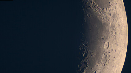 High-resolution banner shows lunar crescent terminator cratered region. Astrophotography taken through telescope, capturing lower lunar limb with prominent crater formations and highlands
