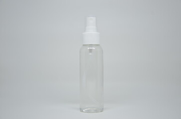 Clear plastic spray bottle with a white cap on a clean white background. Ideal for beauty, cleaning, or DIY product mockups.