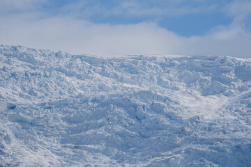 Svinafellsjokull Glacier in Iceland captivates with stunning icy formations against a backdrop of...