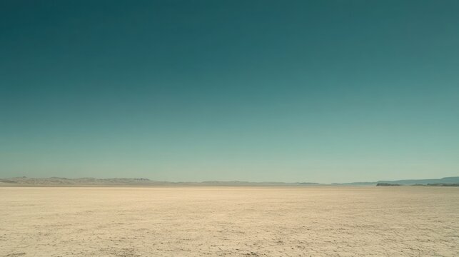 Fototapeta Expansive desert landscape under clear teal sky minimalist nature photography