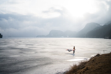Wind surfer on frozen lake