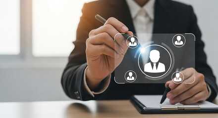 Businessman pointing at transparent virtual interface with user icons representing social network connection people management or human resources strategy
