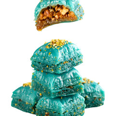 Turquoise colored sweets against dark background