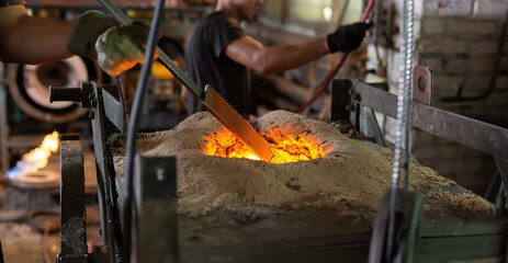 Ferrous metal billet is melted in an induction furnace closeup