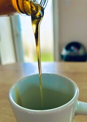 pouring oil into a glass