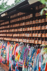 Colorful Origami Cranes and Ema Wooden Plaques at a Japanese Shrine