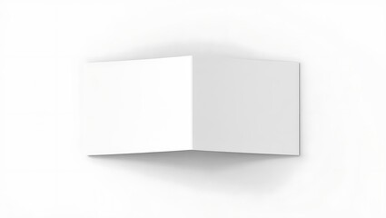 A minimalist studio shot of a blank white folded card against a white background with soft shadow