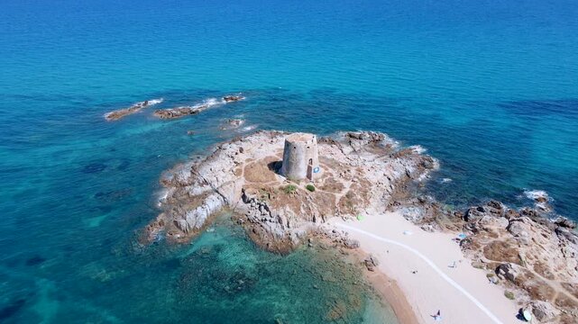 Scenic Aerial Orbit of Torre di Bari Sardo, Historic Coastal Tower in Sardinia, Italy