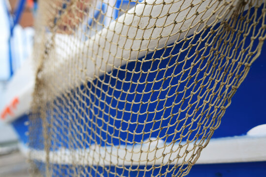  Fishnet on a boat side. Koroni. Greece