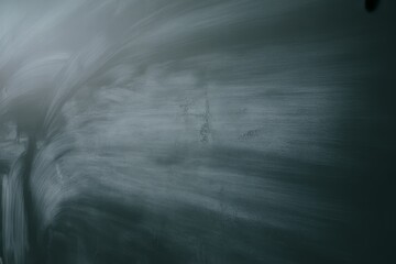 Obraz premium Dusty chalkboard surface with smudged chalk marks blackboard