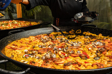 Preparing a delicious seafood paella