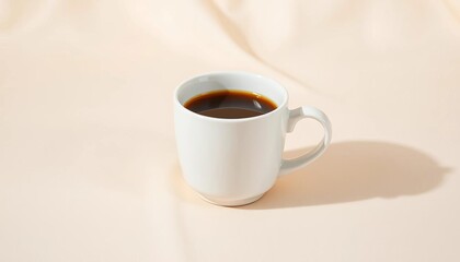 A pristine white coffee cup sits atop a subtly textured cream backdrop, food, drinkware