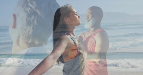 Stretching grey-clad Asian woman breathing on beach at sunrise, with praying man and senior overlay