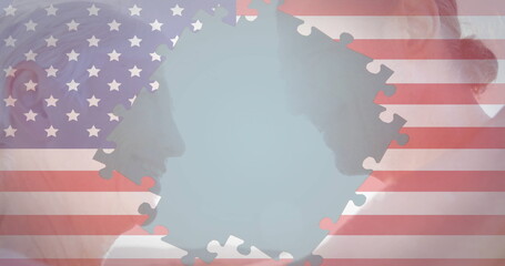 Displaying older man and woman profiles facing each other in studio, with US flag puzzle piece