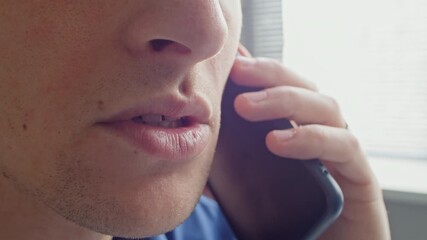 Extreme close up on unrecognizable businessman talking on smartphone with client planning meeting while working indoors, copy space - Powered by Adobe