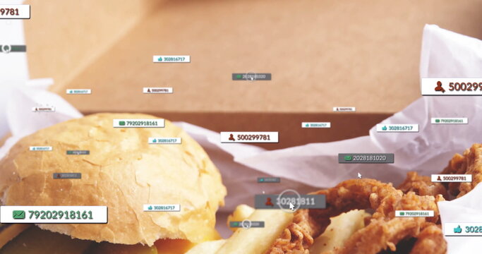 Displaying take-out box showing sesame bun burger, fries and chicken in kitchen, notification icons