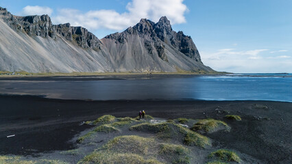 Gaze upon the stunning Vestrahorn mountain rising majestically over a contrasting black sand beach...