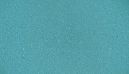 A solid teal blue-green paper texture background. A concept of serene minimalism and a clean abstract backdrop for creative design.