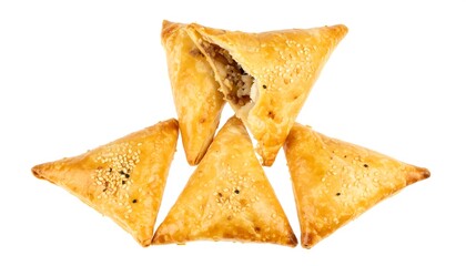 Golden triangular pastries on white background